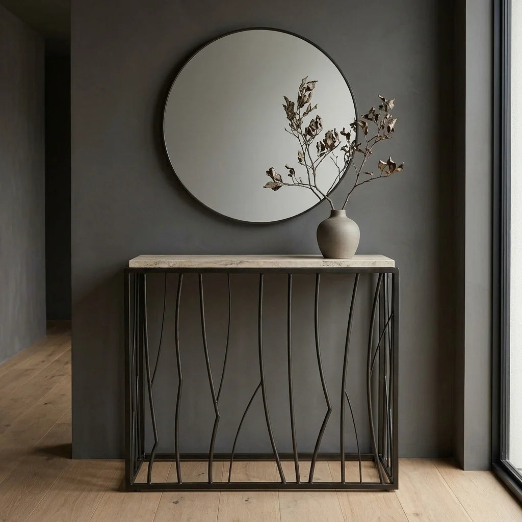 36" Travertine Top Console Table with Dark Iron Metal Base. Inspired by natural landscapes, this console table has an asymmetrical metal base in dark iron, paired with a natural travertine top. Shown in a Dark Japandi entryway.