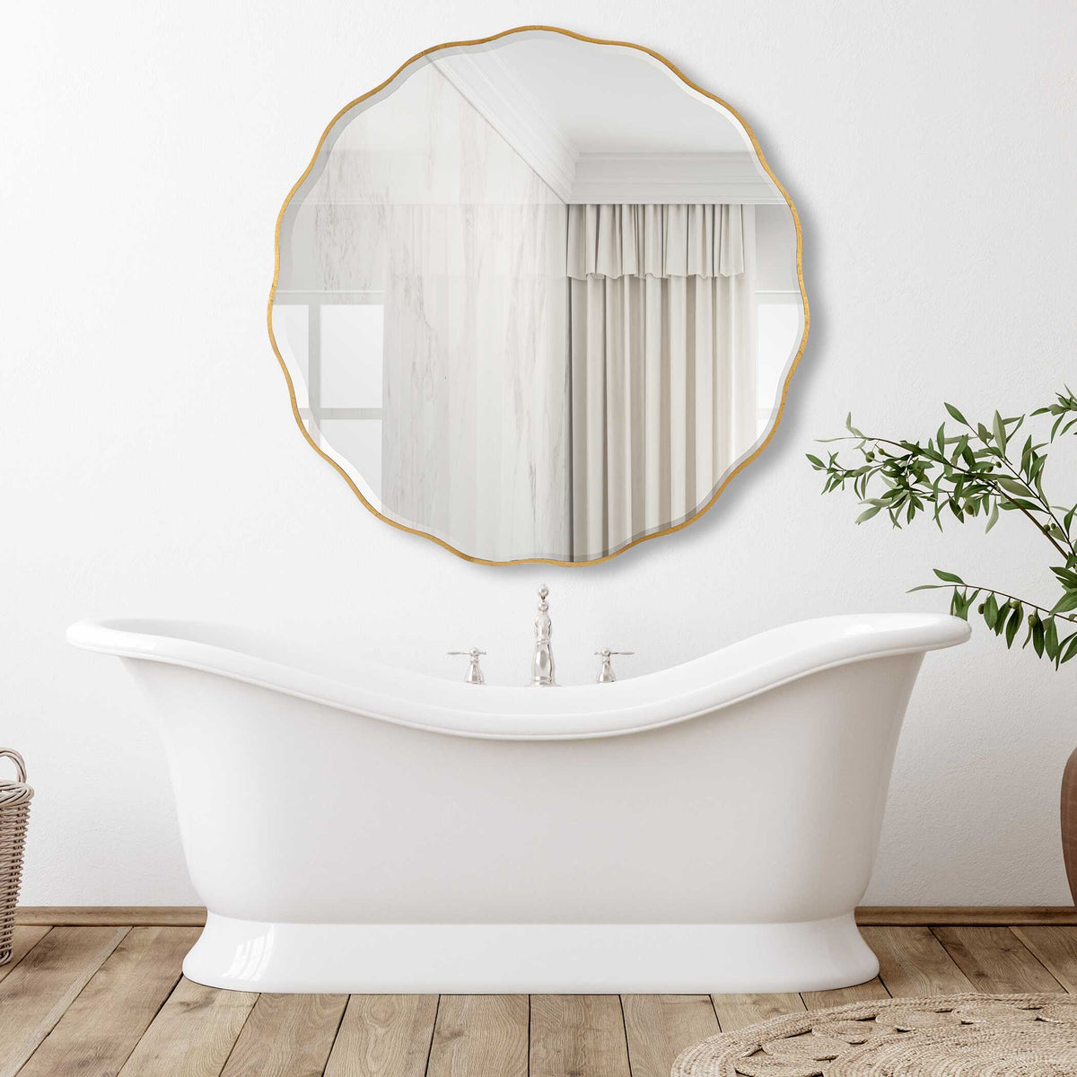 Uttermost 09943 Aneta round mirror hung above a freestanding tub in a bright bathroom