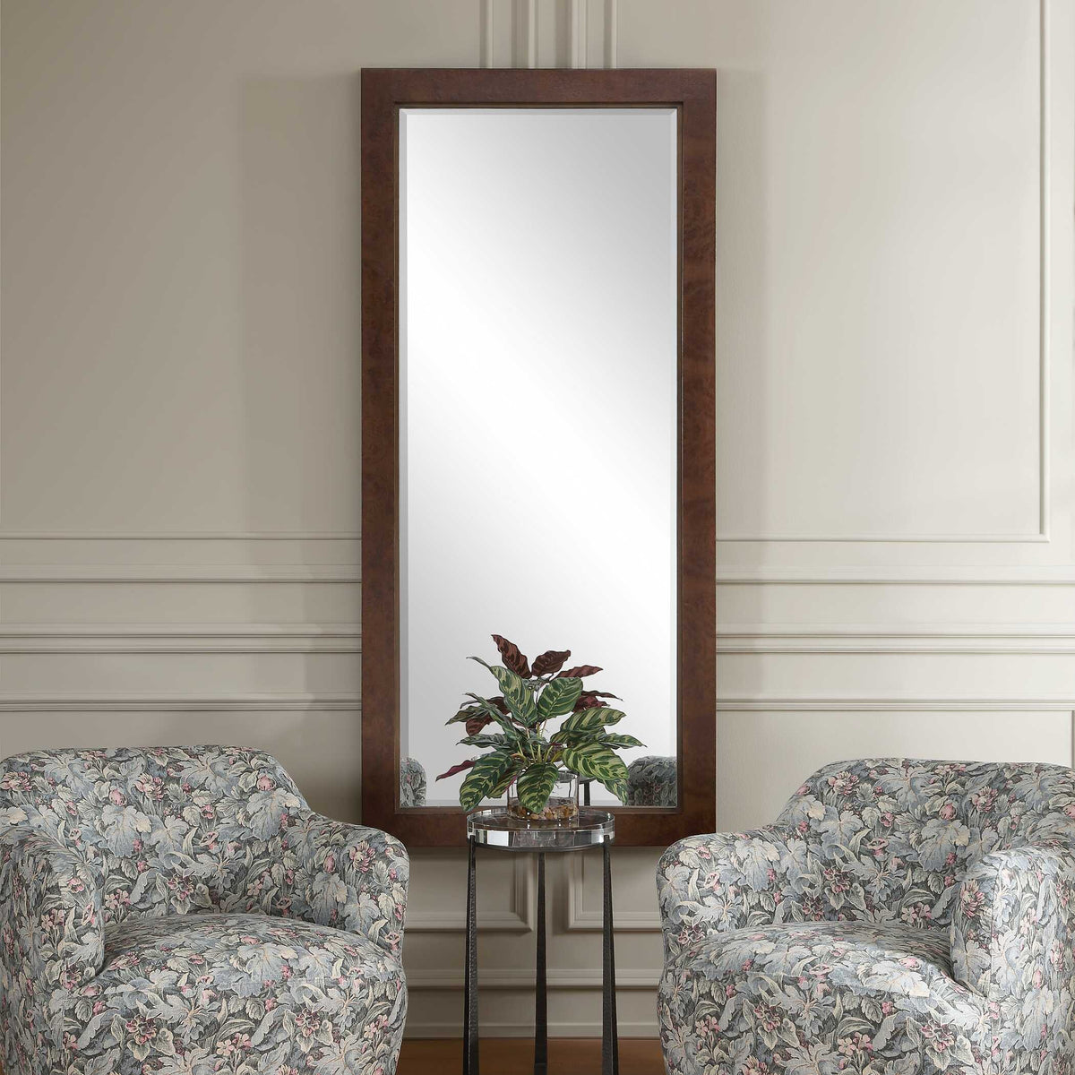 Uttermost 08374 Durant collection tall mirror between floral armchairs on a paneled wall
