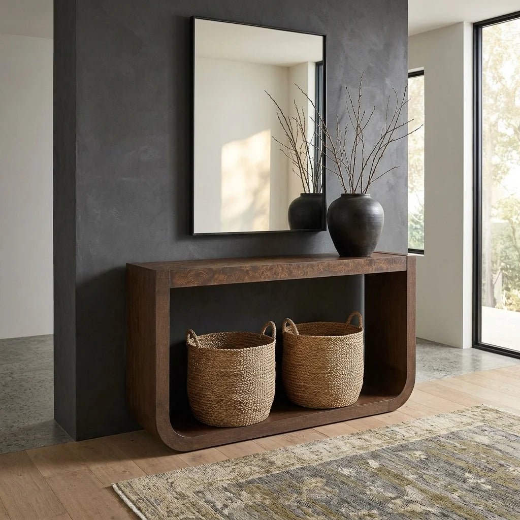 58" Dark Walnut Oak Veneer Console Table with Burl Veneer Top. This 58-inch console table has a streamlined silhouette finished in dark walnut oak veneer, topped with a richly grained burl veneer that adds depth. Shown in a Dark Organic Modern entryway.