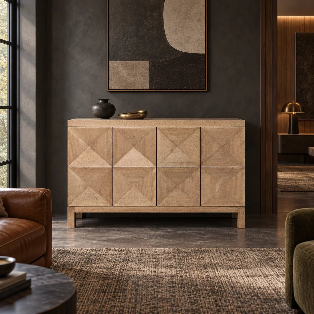52" Washed Walnut Geometric Carved 2 Door Sideboard. This handcrafted and beautifully finished walnut sideboard features two geometrically carved doors that open via hidden push latch to reveal one large interior cupboard. Shown in a dining room.