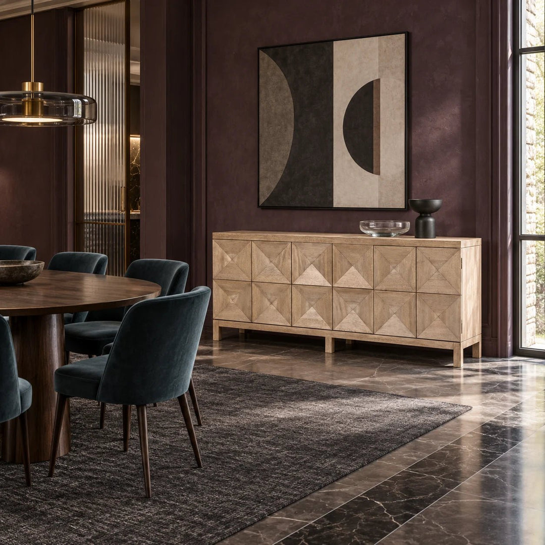 76" Washed Walnut Geometric Carved 3 Door Sideboard. This classic yet contemporary design features three geometrically carved doors that open via hidden push latch to reveal two large interior cupboards. Shown in a dining room.