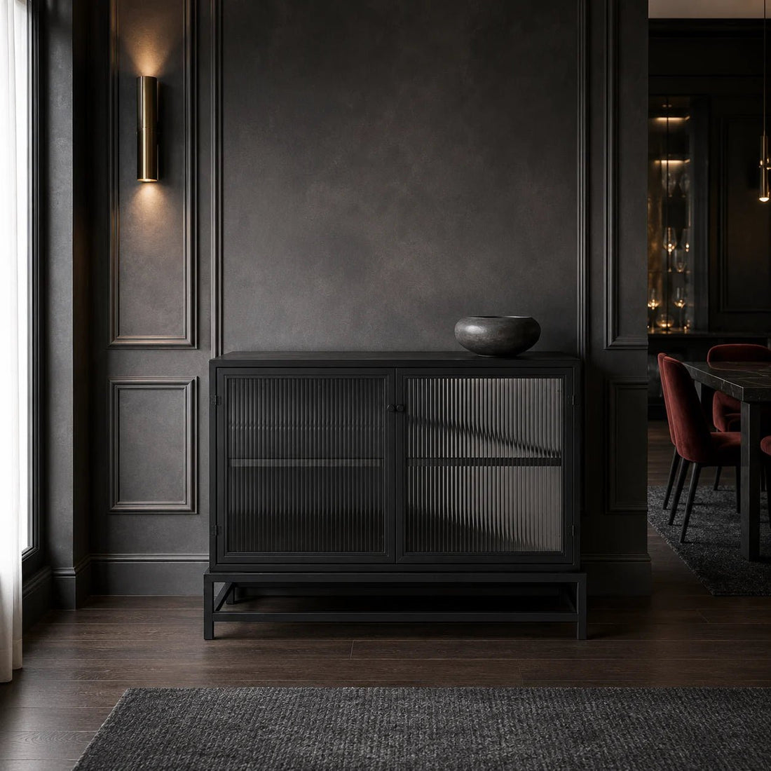 Chandler 2 Door Sideboard in Matte Black by Noir (GCON426MTB). It features two doors that open to reveal ample storage space, making it a practical choice for organizing your belongings. Shown in a living room.