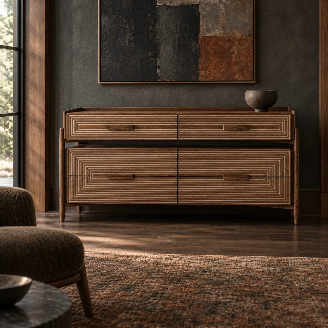 60" Dark Walnut 4 Drawer Mid Century Sideboard. With its sleek form and richly grained walnut finish, the Savino Sideboard embodies the beauty of modern simplicity. Shown in a dining room.