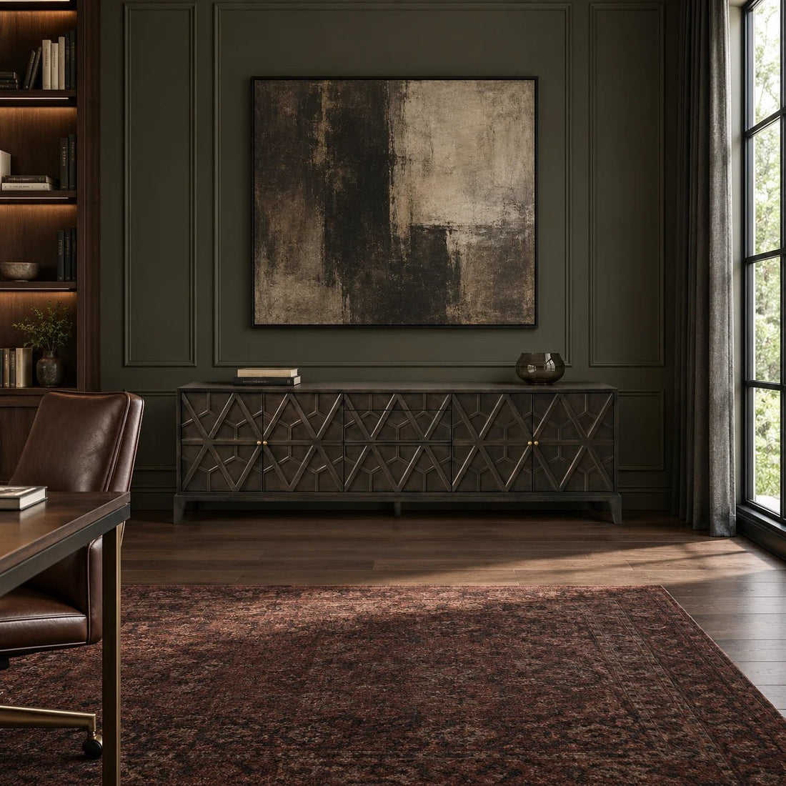109" Pale Mahogany Geometric Millwork Sideboard. An oversized Pale-finished credenza featuring sculptural geometric millwork, subtle brass pulls, and tapered legs. Shown in a dining room.
