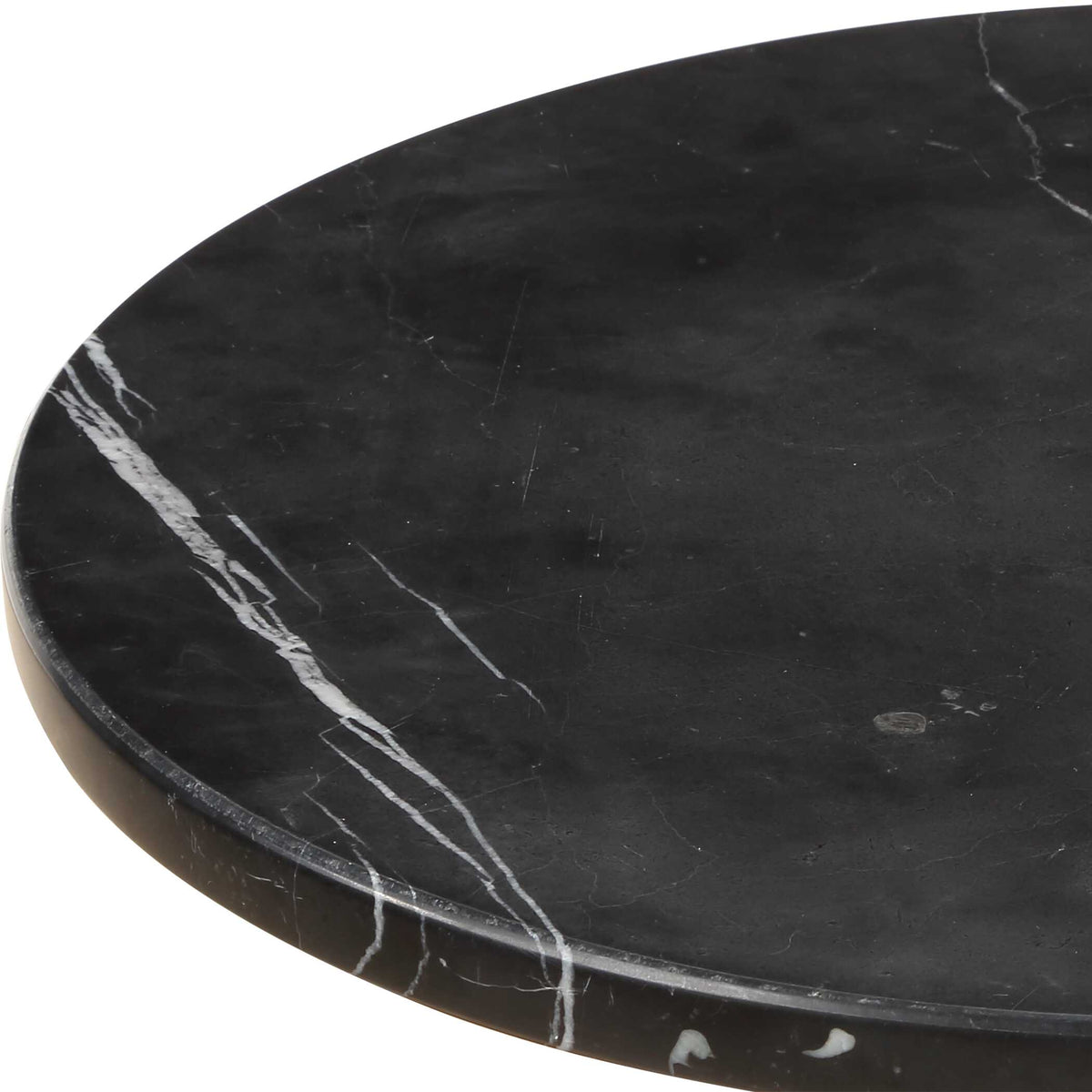 Close-up of a black marble tabletop with white veining, Dark Academia drink table detail