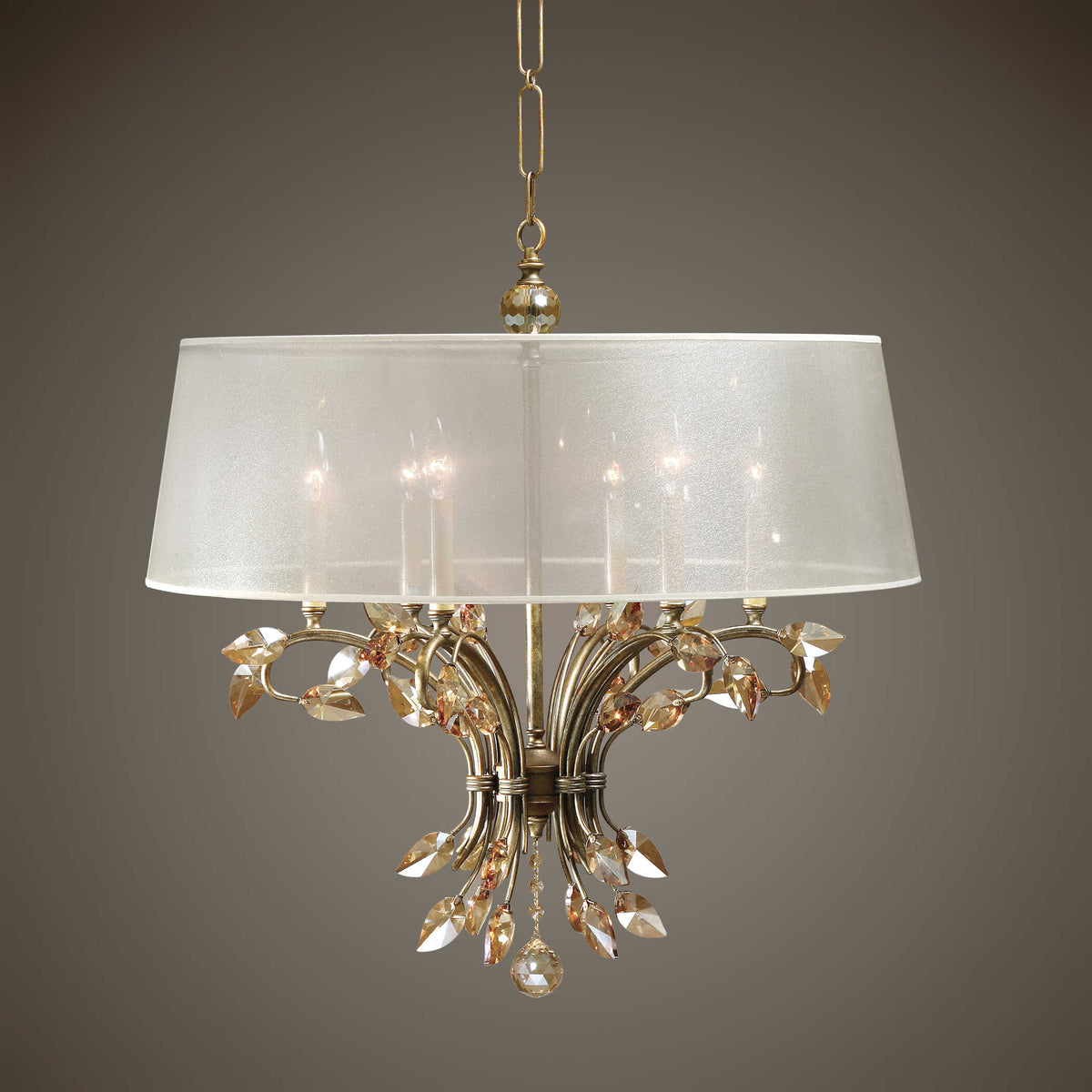 Alenya crystal leaf chandelier with champagne sheer shade, lit against a gray studio backdrop