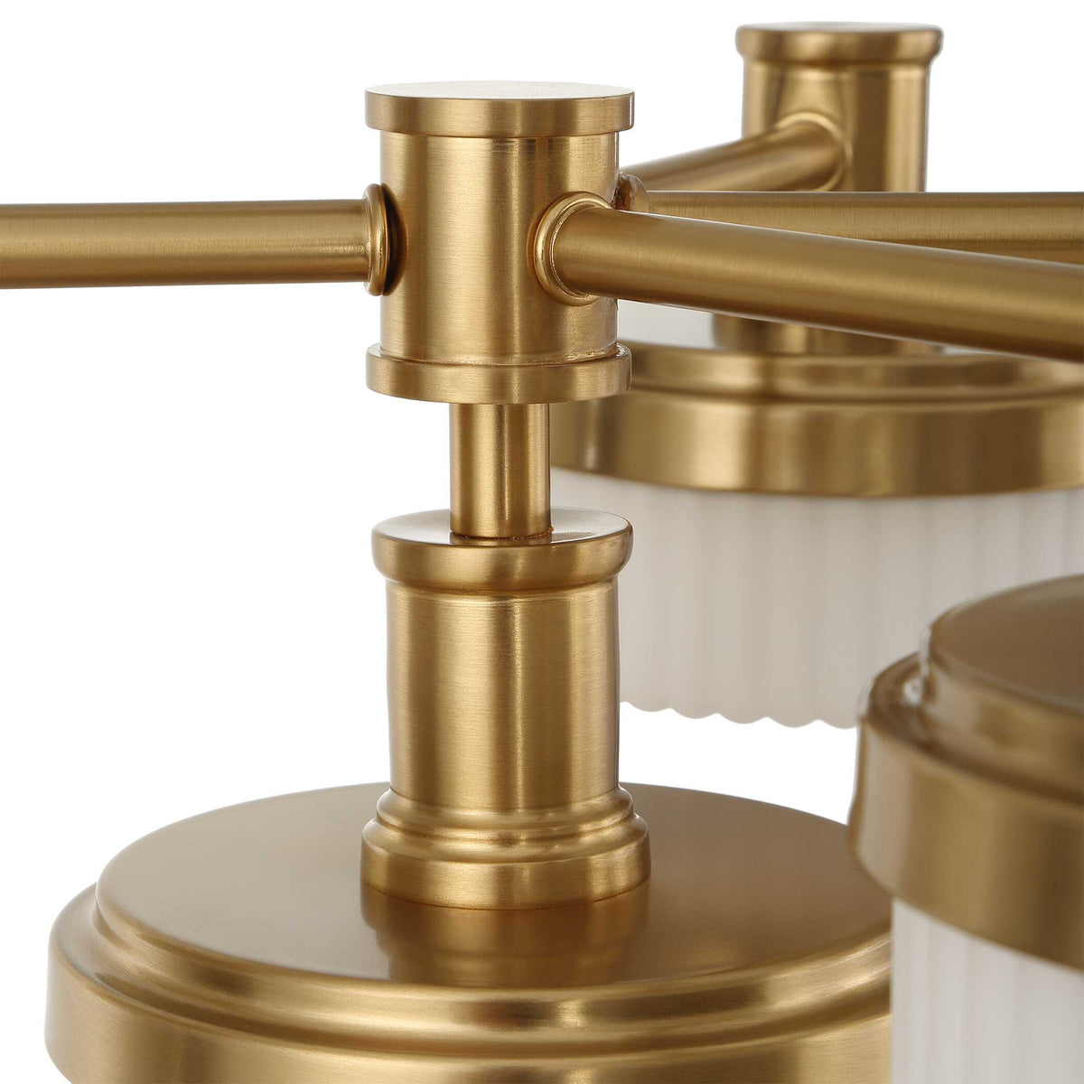 Close-up of brass arm joints and stacked fittings on the Dark Academia chandelier