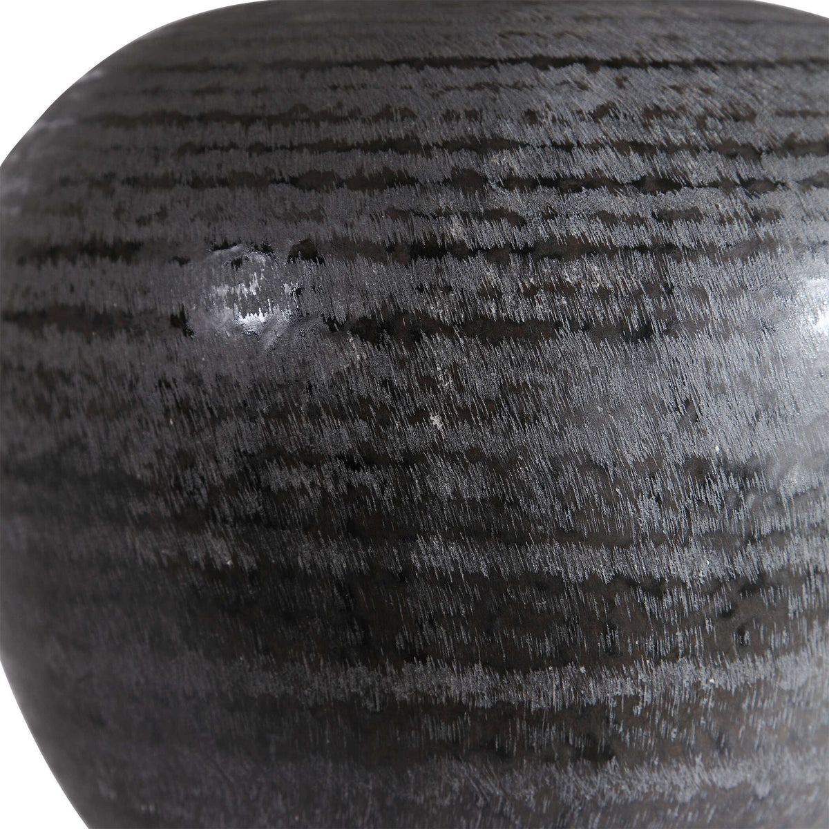 Close up of the etched charcoal glaze texture on an Organic Modern gray ceramic nightstand lamp, 9.5 pounds