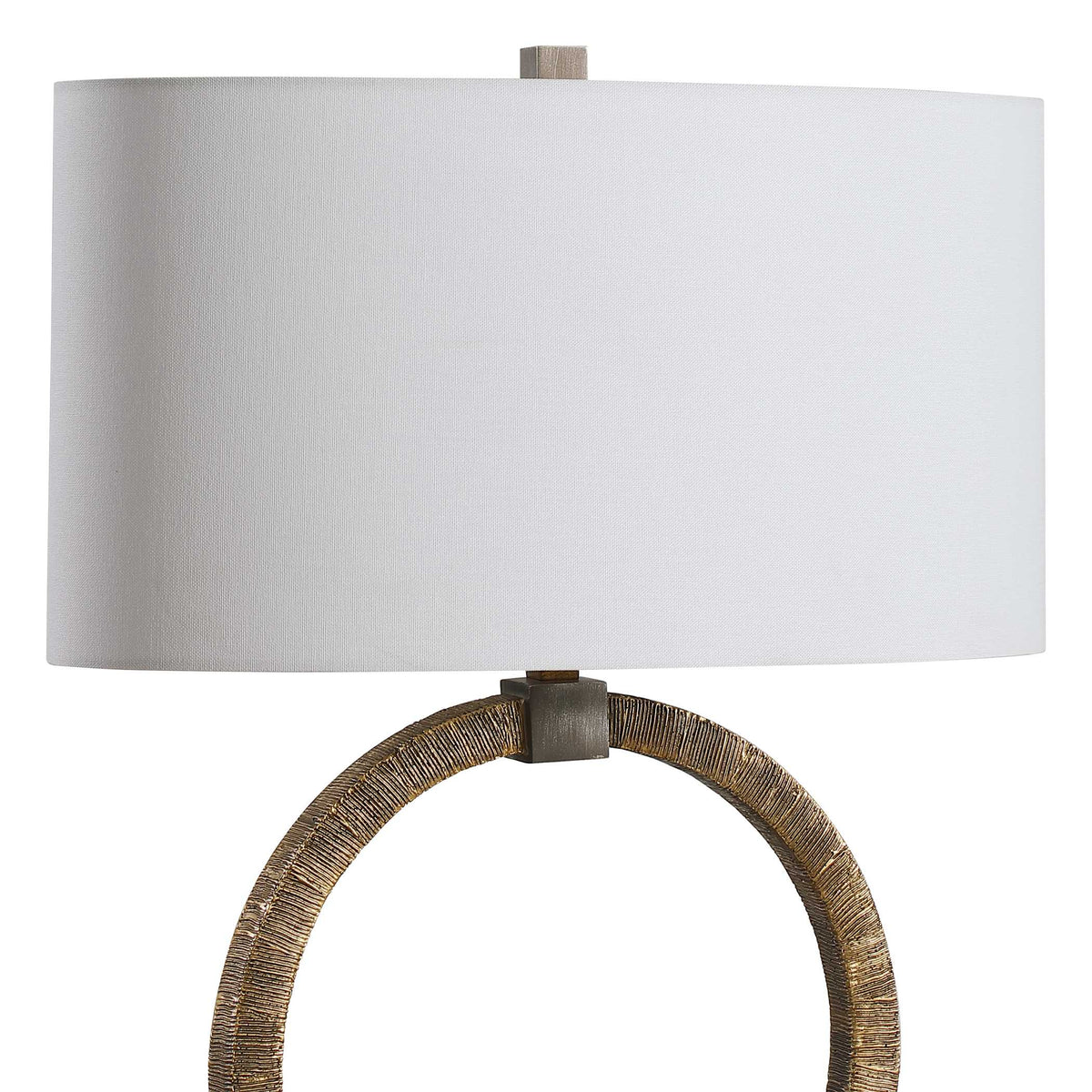 Close view of the oval white hardback shade and the heavily antiqued gold ring on this Dark Academia bedside lamp