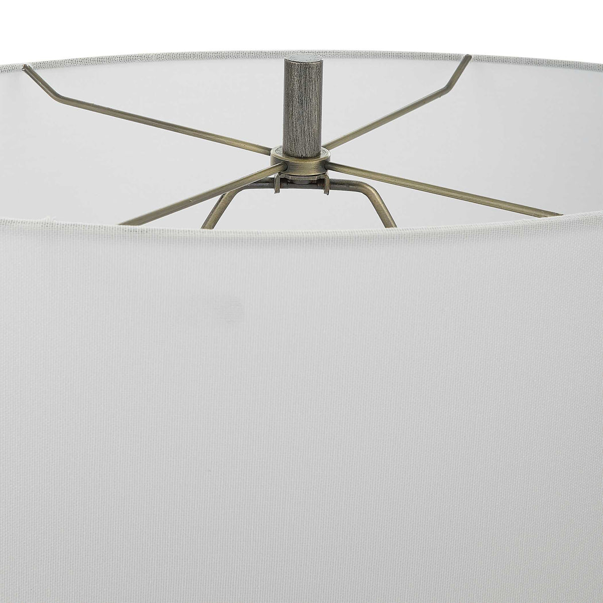 Dark Steel Gray finial and shade spider inside the white oval shade of a contemporary iron living room lamp
