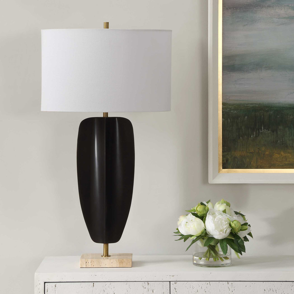 Art Deco living room lamp with tribal sculpture iron body on a thick travertine foot