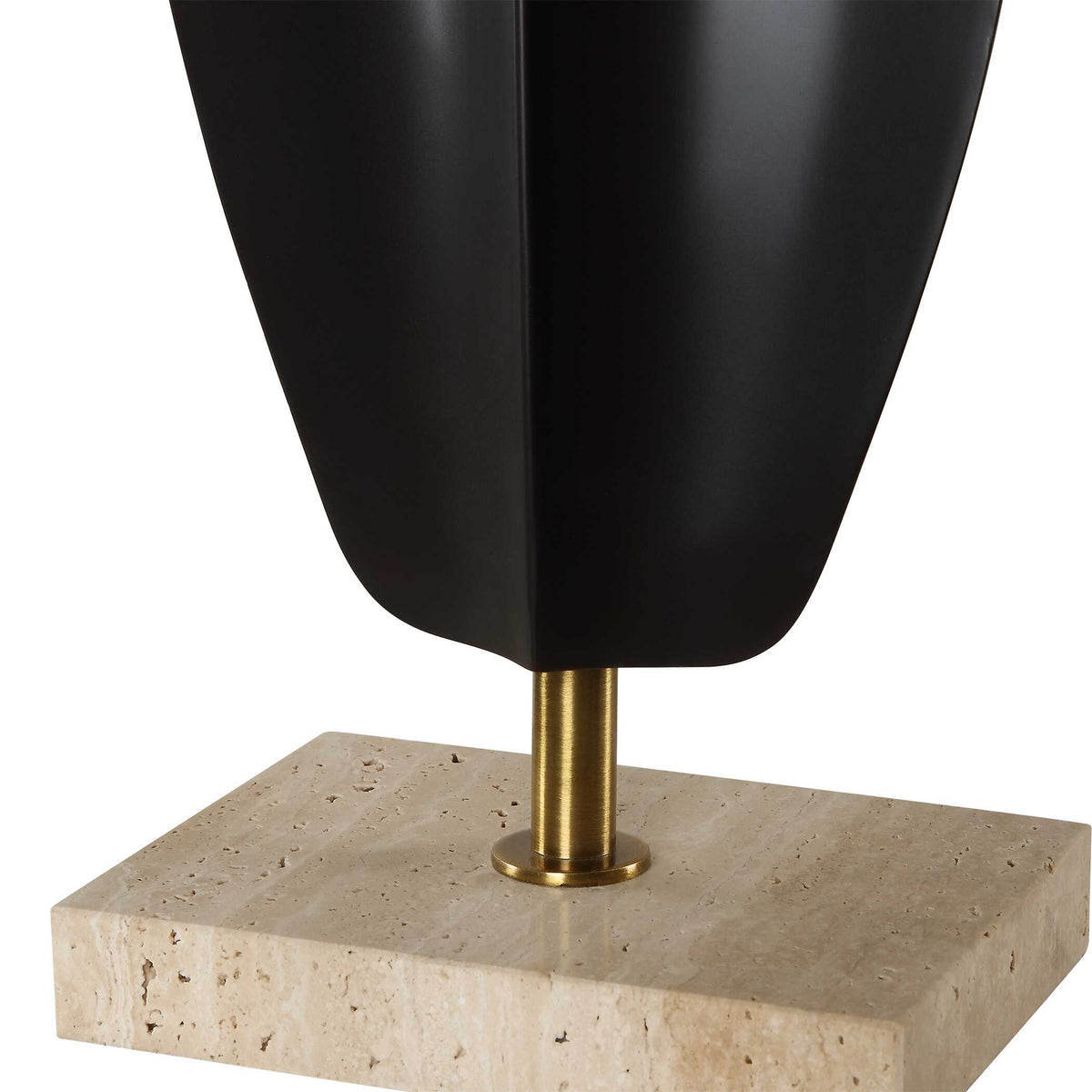 Detail of the matte black iron sculpture on plated brass columns and a natural travertine foot