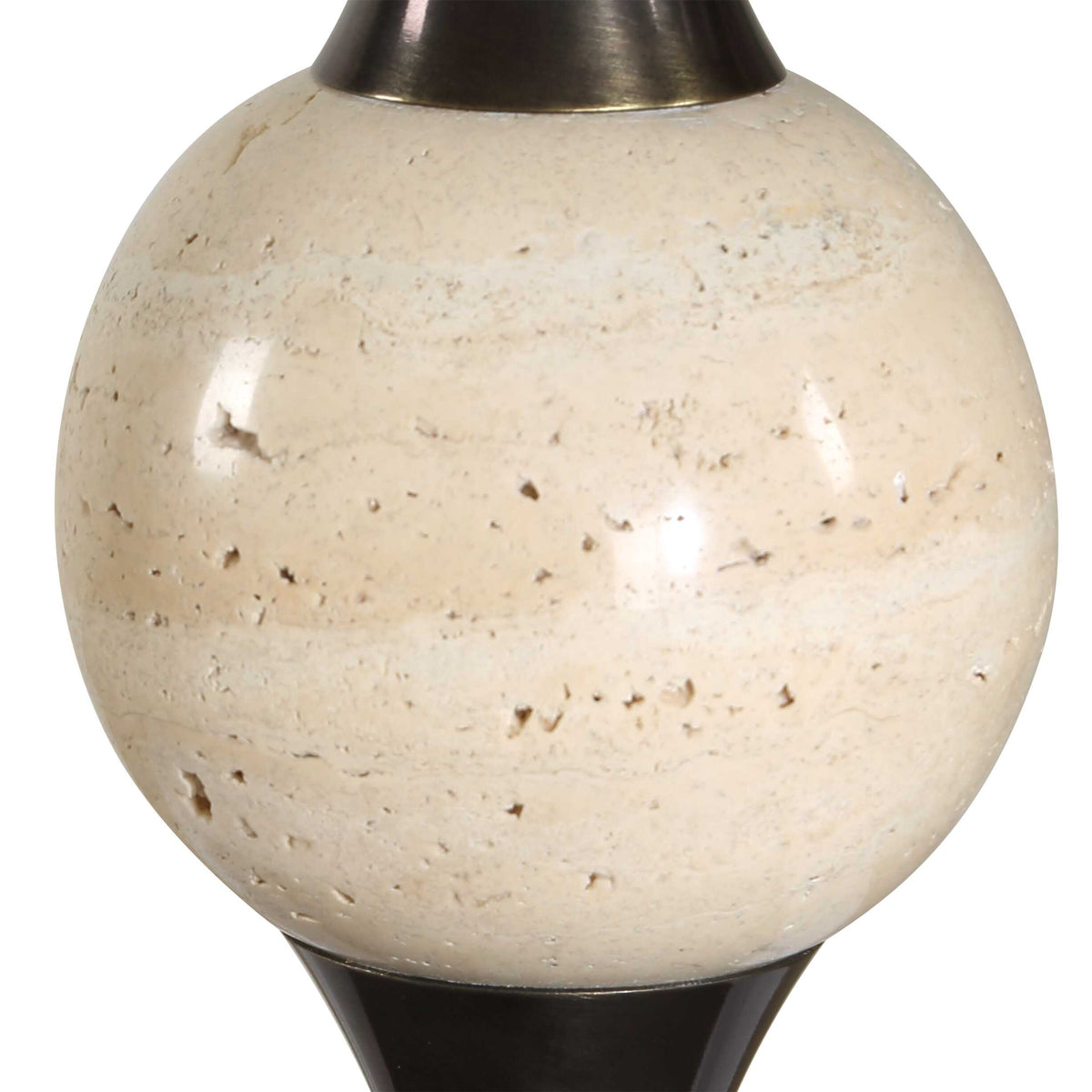 Detail of the pitted off-white travertine orb between dark bronze flares, Old Money Vintage buffet lamp