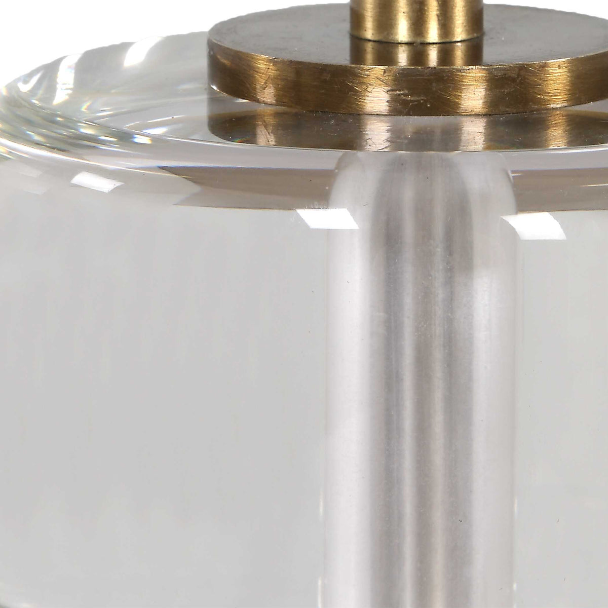 Thick crystal foot and antique brass plated accent detail on a warm black iron console lamp