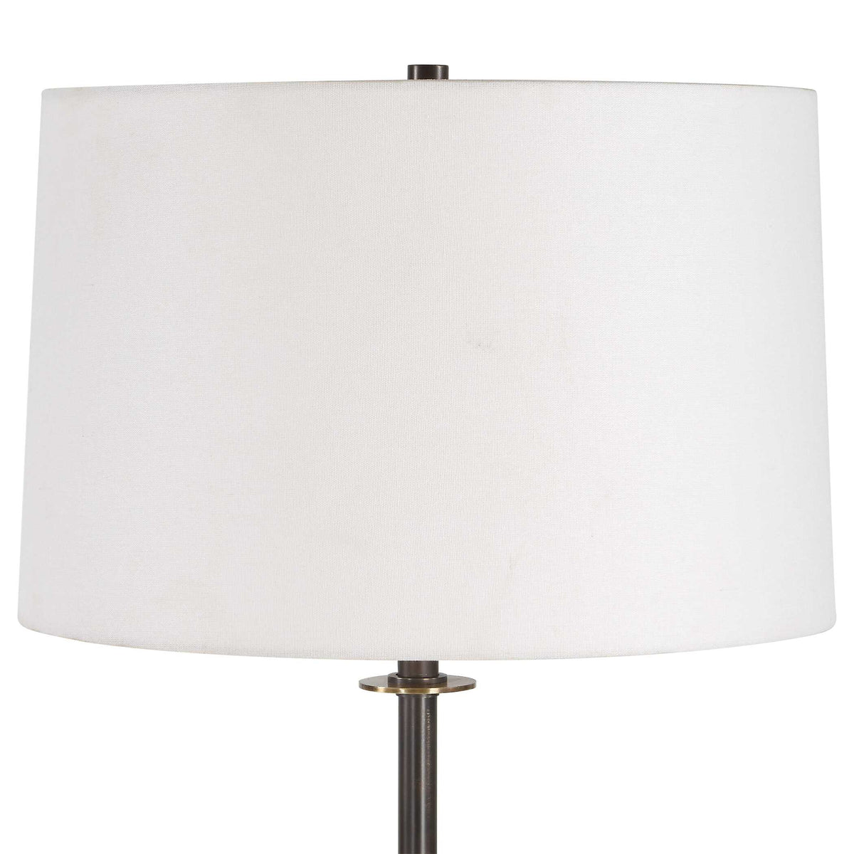 Close up of the white slightly tapered hardback shade and dark bronze finial on a floor lamp