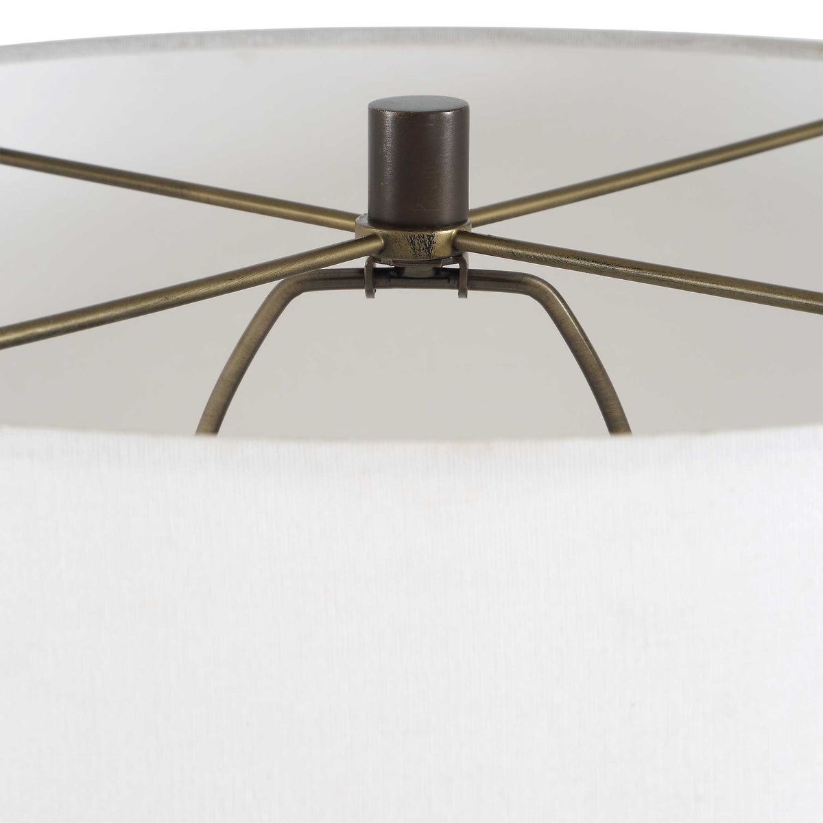 Detail of the antique brass plated spider fitter and finial inside the white hardback shade