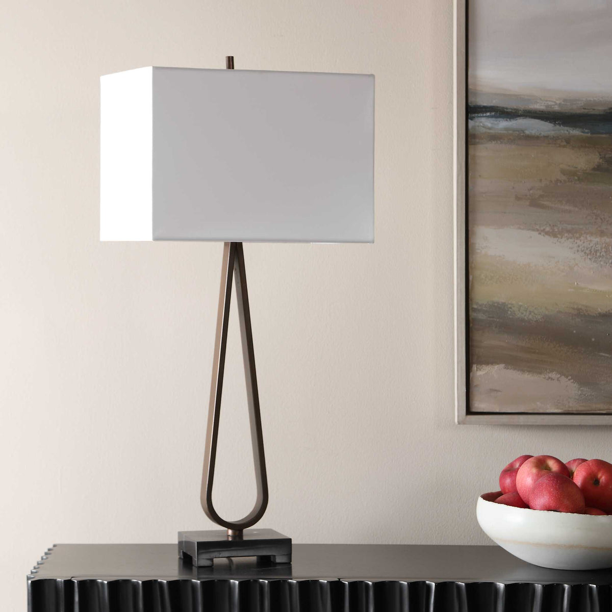 Dark Academia dark bronze iron teardrop living room lamp with rectangular white shade, angled view on a console