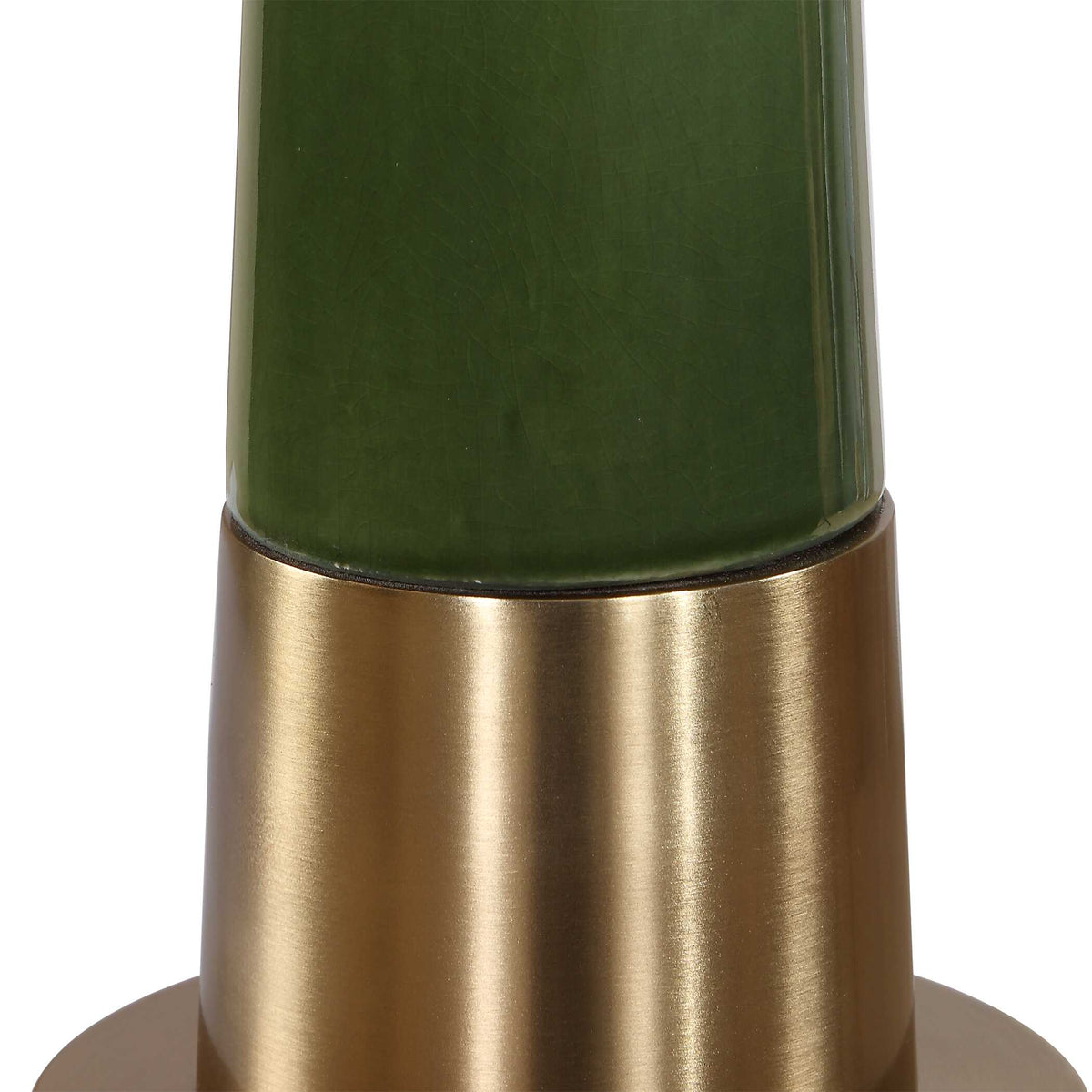 Detail of the glossy moss green glaze meeting the brushed antique brass pedestal of a Vintage Old Money table lamp