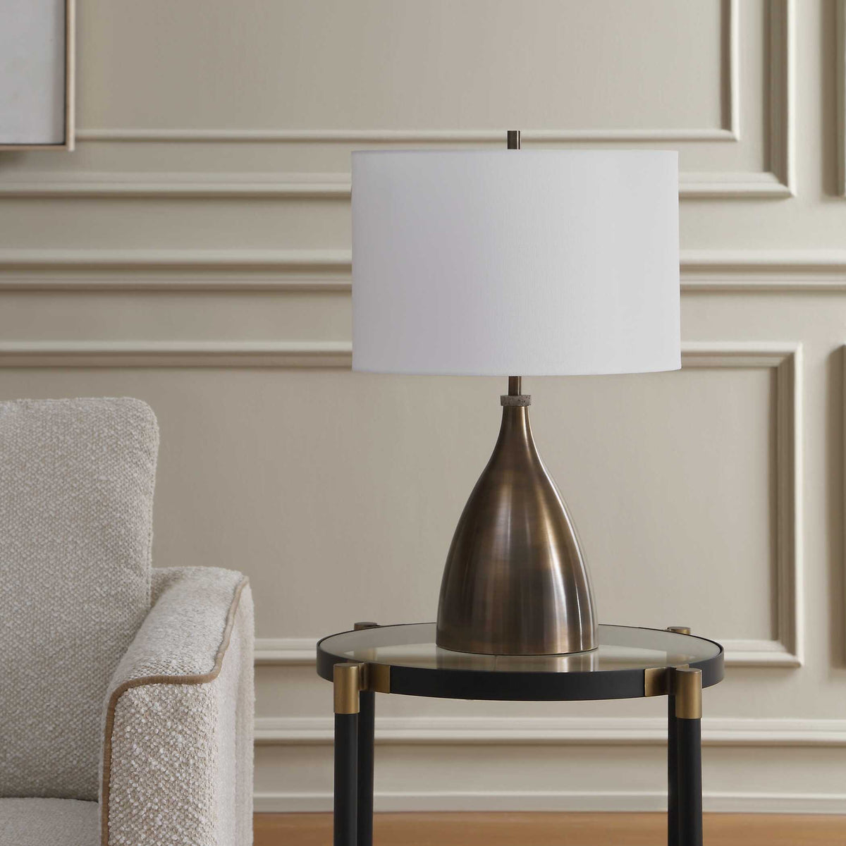 Mid Century living room lamp with rubbed bronze teardrop base and small travertine neck detail