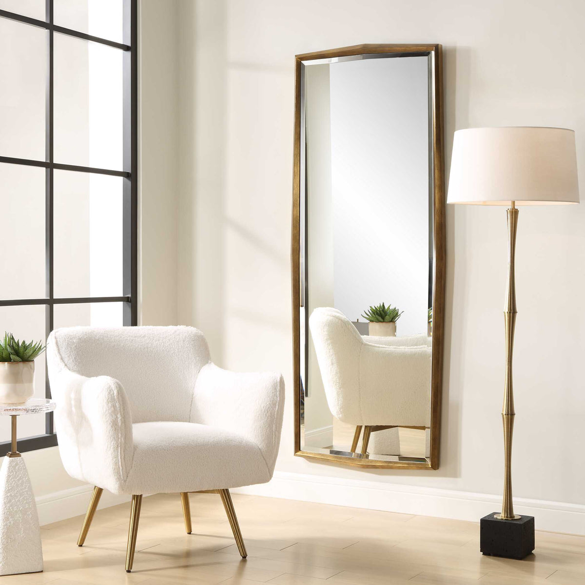 Uttermost 09968 On Point dressing mirror beside a boucle armchair and brass floor lamp
