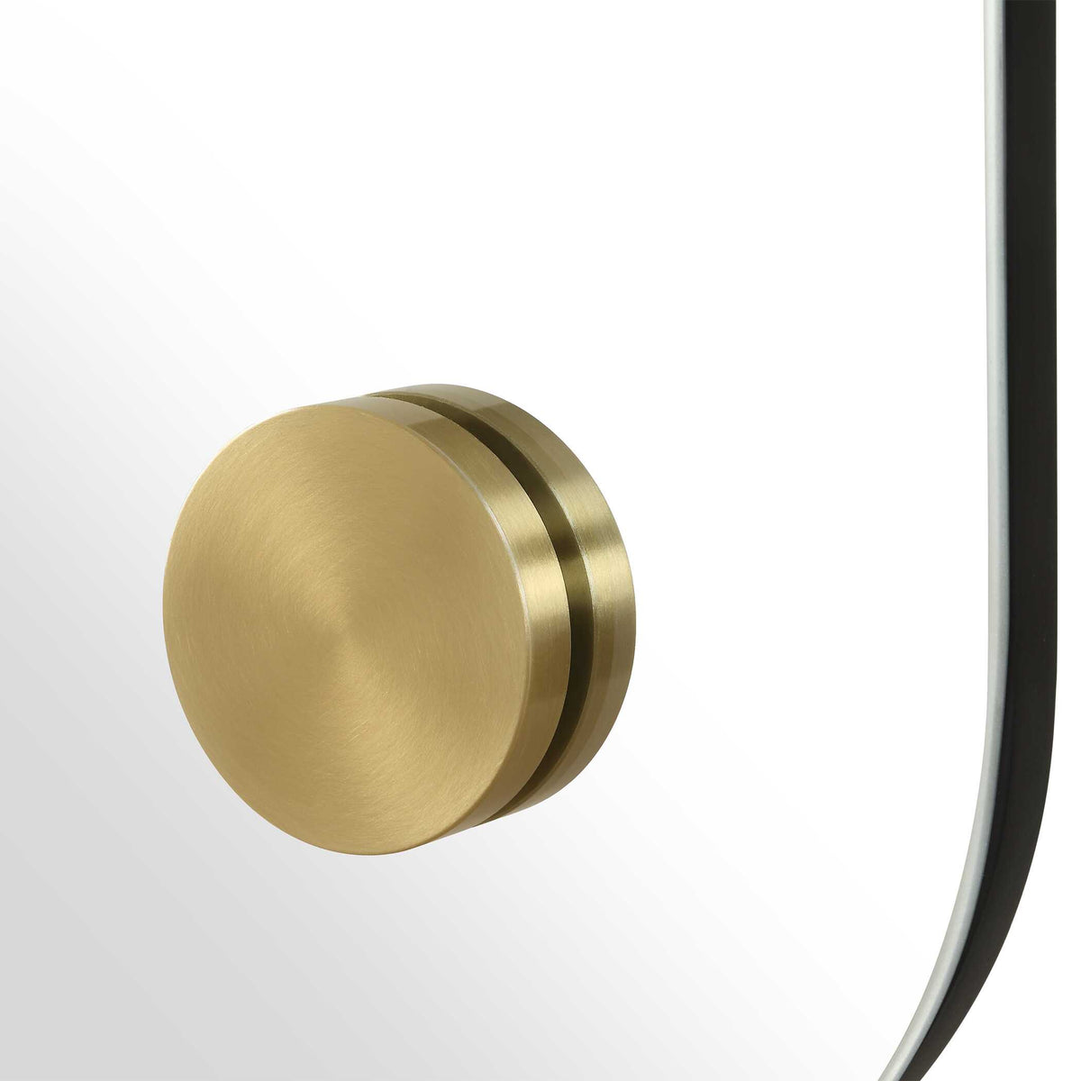 Gold tone brass accents on a polished edge accent mirror with softly rounded corners