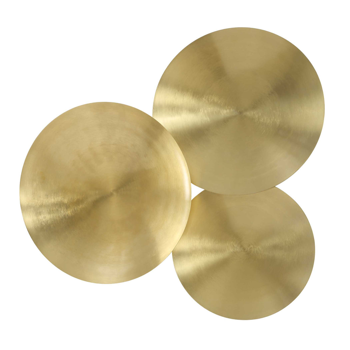 Angled view of round gold metal wall decor discs with a radial brushed look