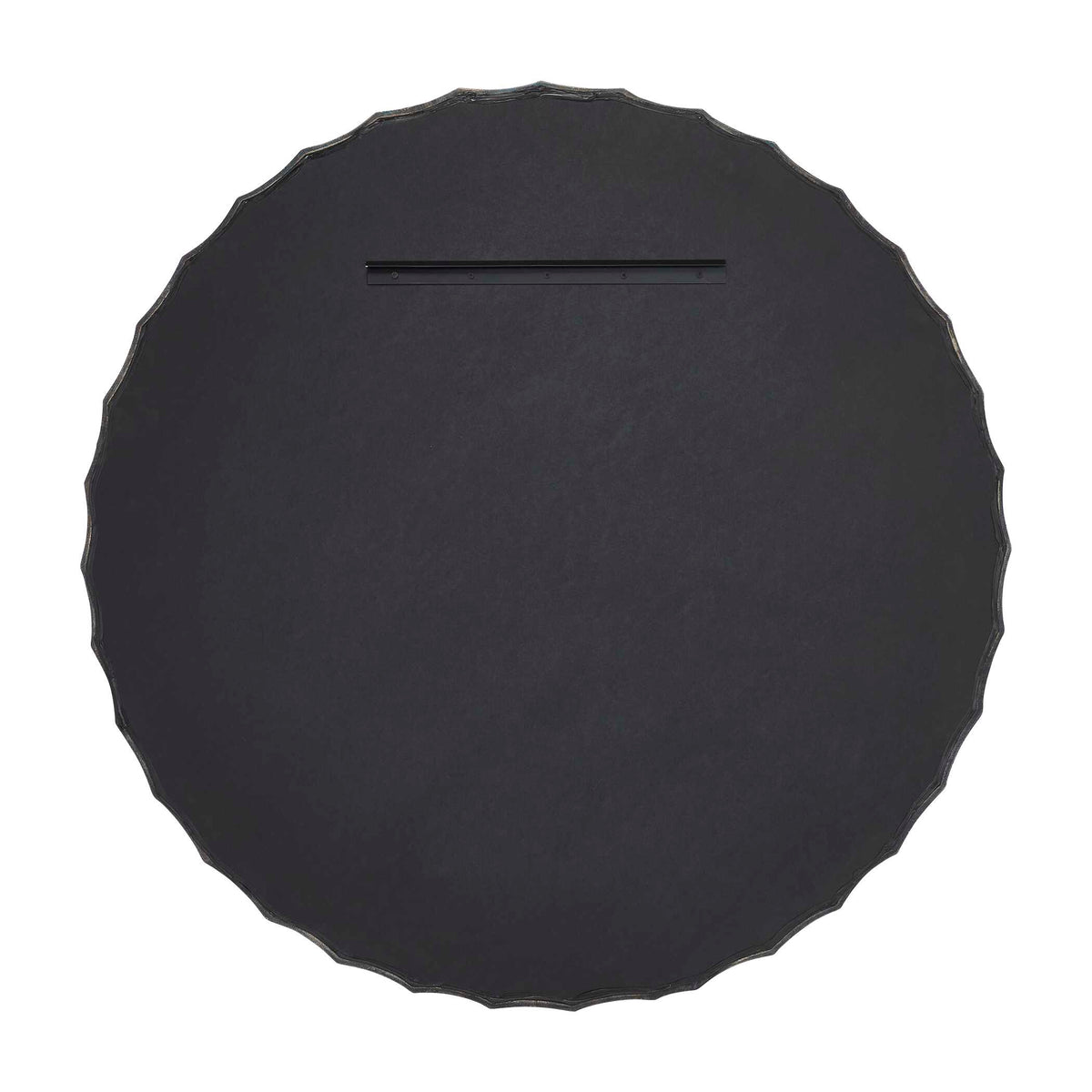 Organic modern round accent mirror in moody charcoal with a subtle pitted texture