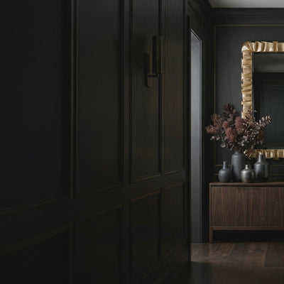 Short product video of the 34 Arcadian Mirror - Champagne Leaf by Ambella Home, a sculptural rectangular wall mirror with a softly folded champagne leaf frame styled above a dark credenza in a luxury entryway