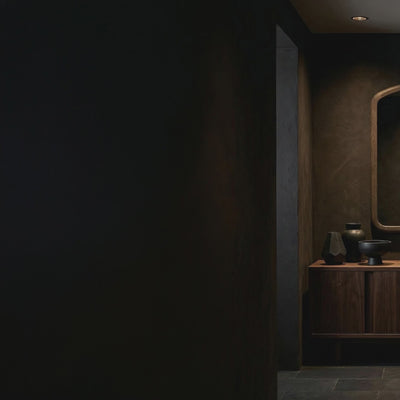 Short product video of James Martin Vanities Solene Mirror in Seaside Oak, 28W x 1.25D x 38H arched wood-framed wall mirror above a dark credenza in a luxury hallway, pack of 2