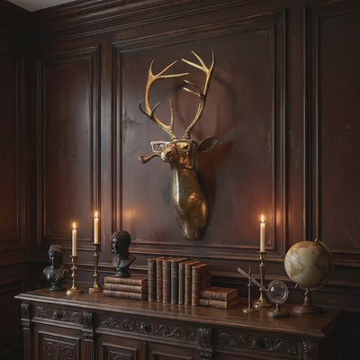 product video of a Frankie the Stag pipe-smoking brass antique gold wall mount styled as gold-wall-decor above a carved wood sideboard with books and candles