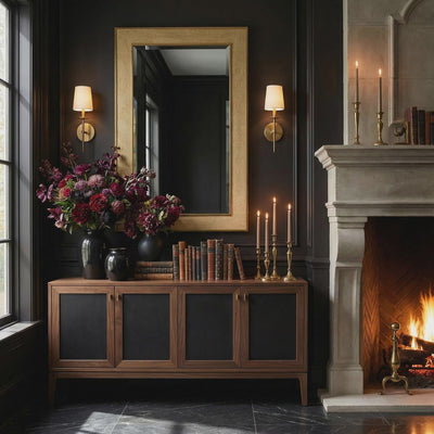 A short product video about Ambella Home Collins beveled wall mirror with faux crocodile skin frame and brass edge styled above walnut credenza beside fireplace